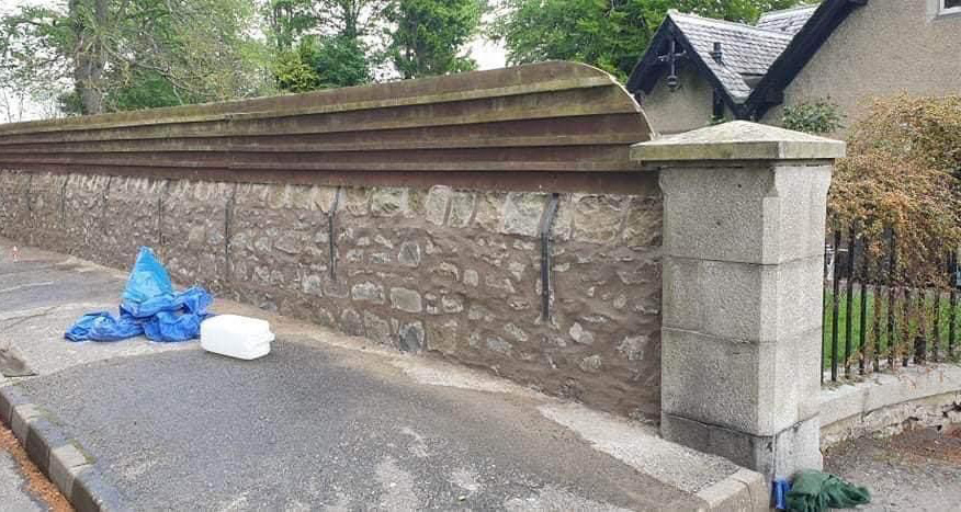Stone wall being repaired